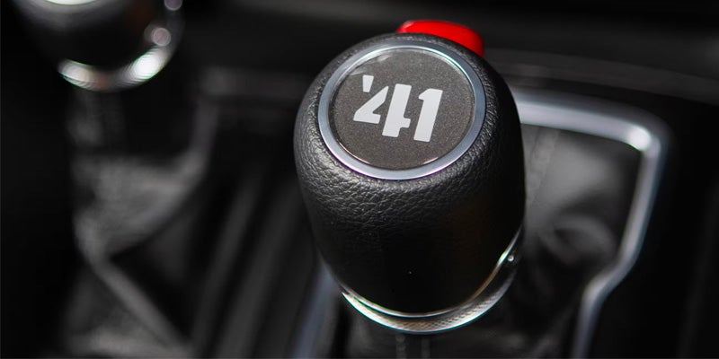 A close-up of a Jeep Wrangler gear stick with the number '41' displayed on it.